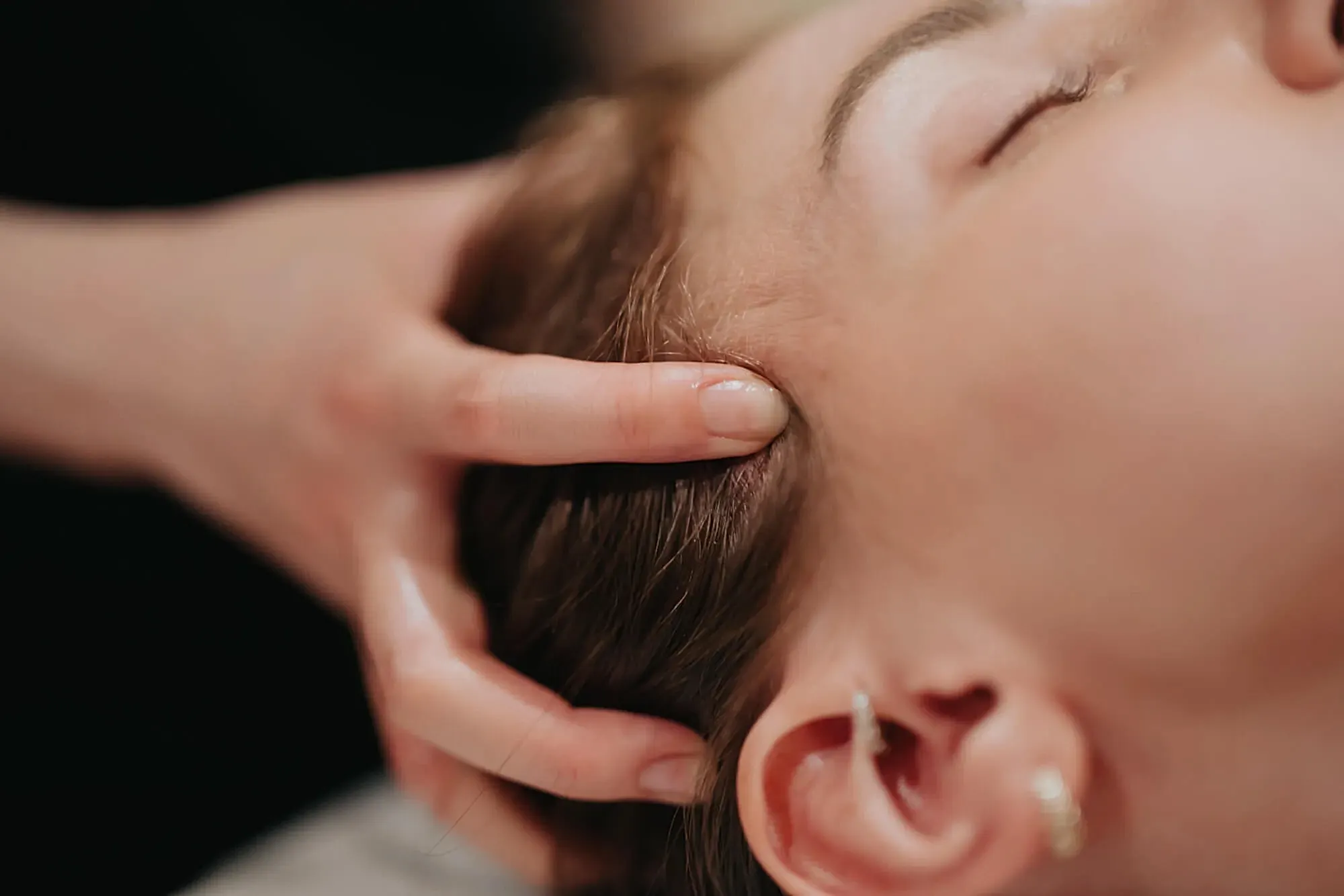 Benefits of Pure Serenity Spa Package Relaxing head massage for a woman