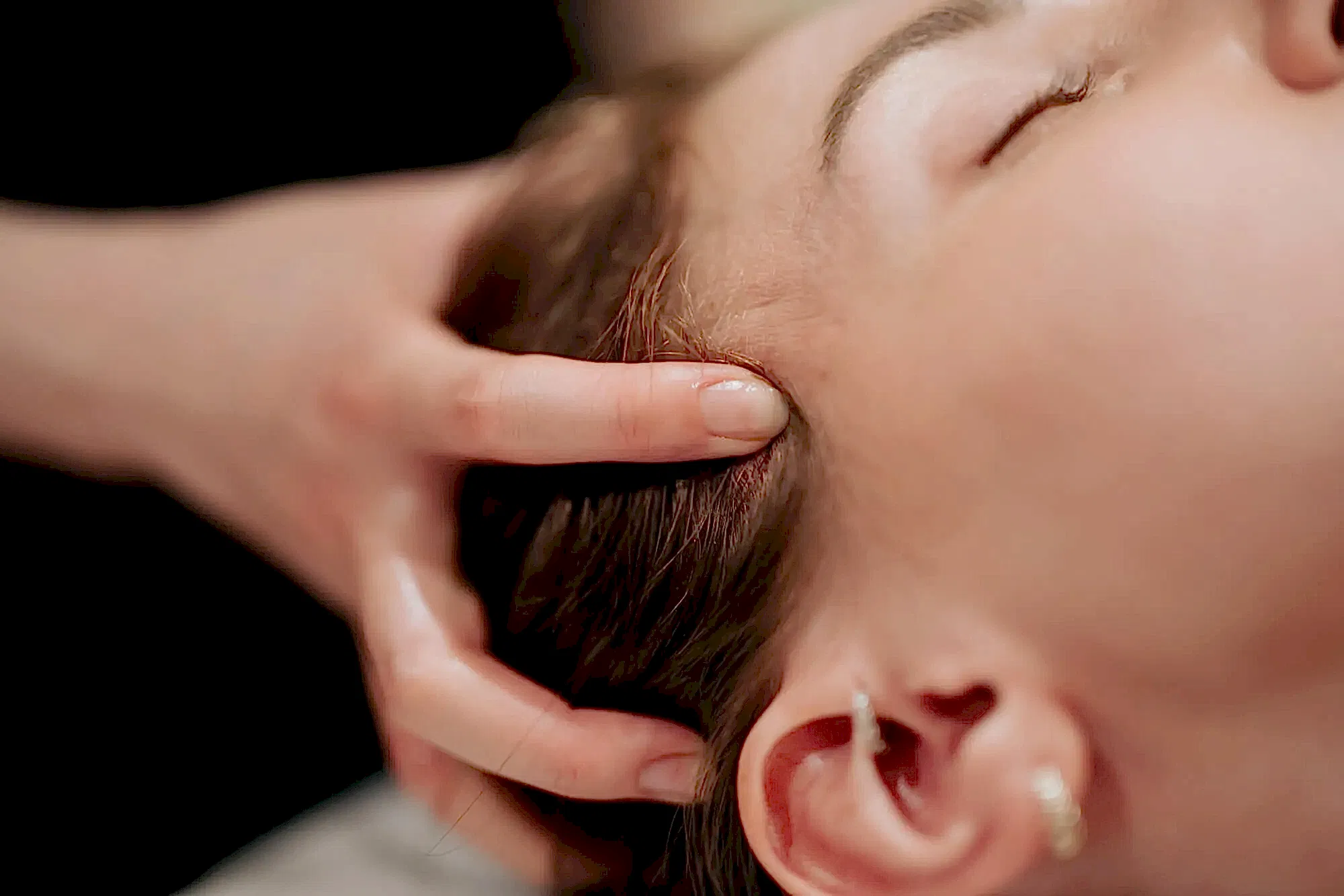 Pure Bliss Spa Treatment Closed up of a woman's head massage