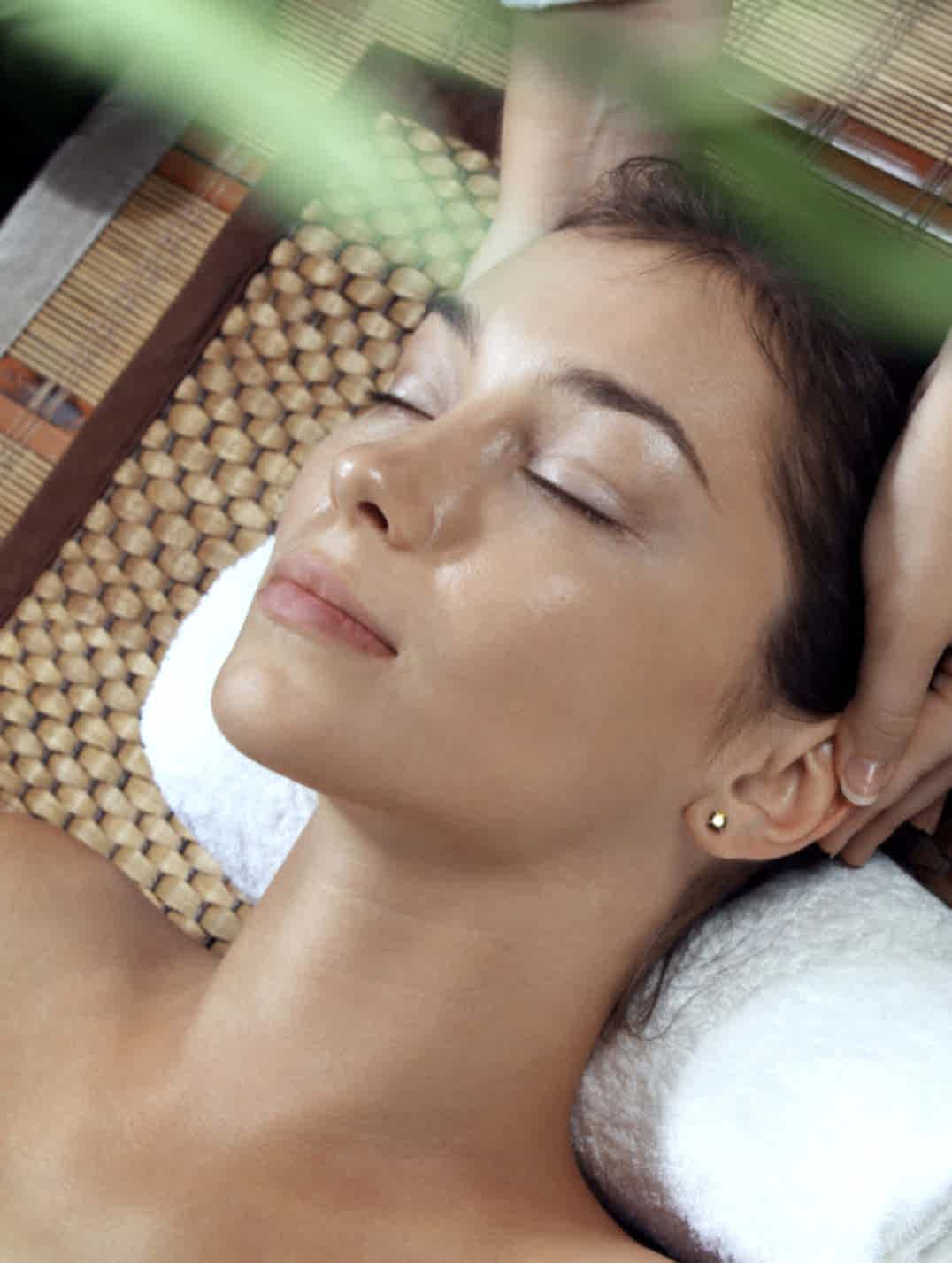 woman relaxing with head massage
